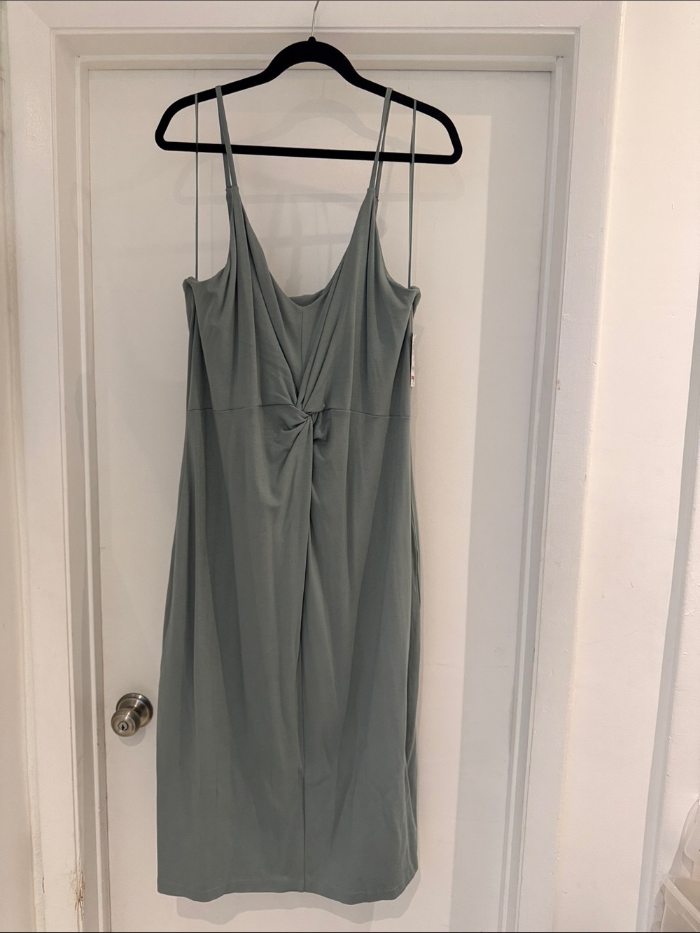 Green strappy Dress with knot feature.